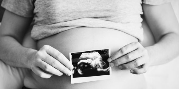 Pregnant Lady Holding Ultrasound